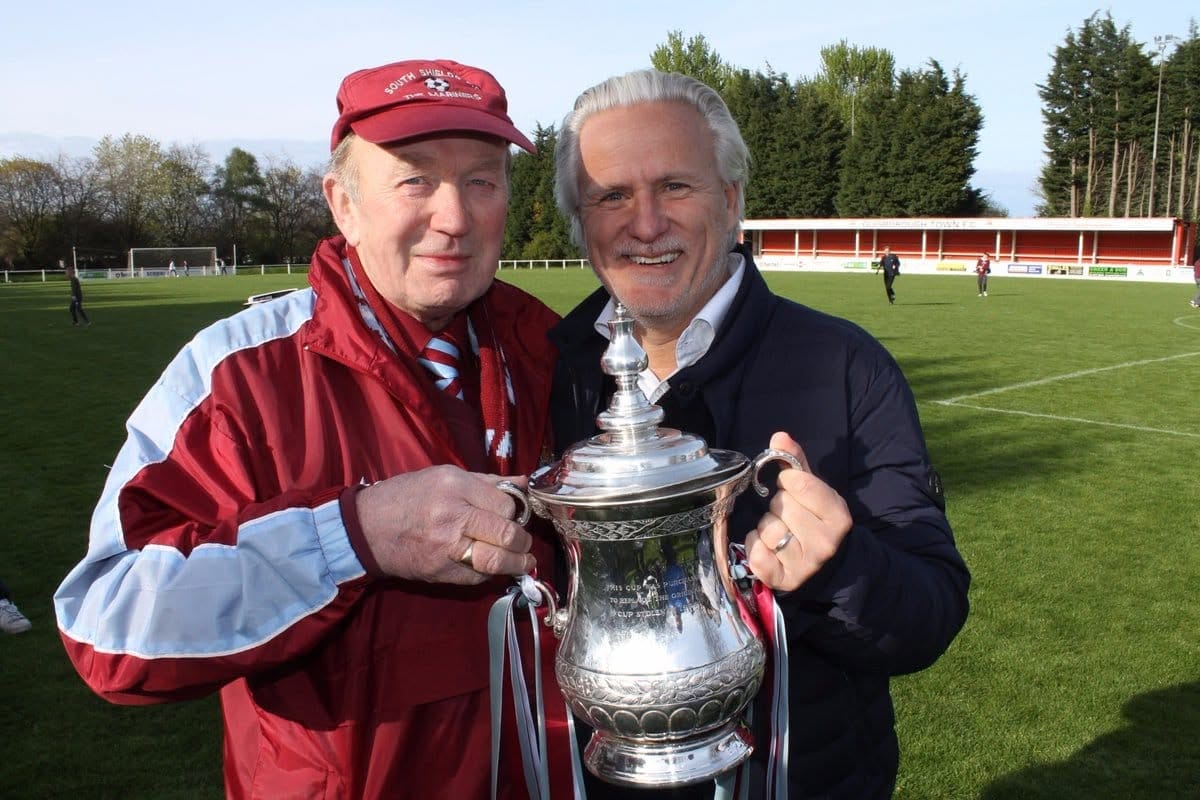 Bob Wray, SSFC archivist photographed with Geoff Thompson holding trophy.