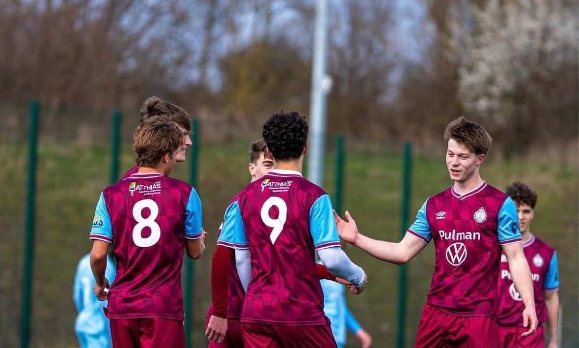 SSFC Academy players celebrating after goal.